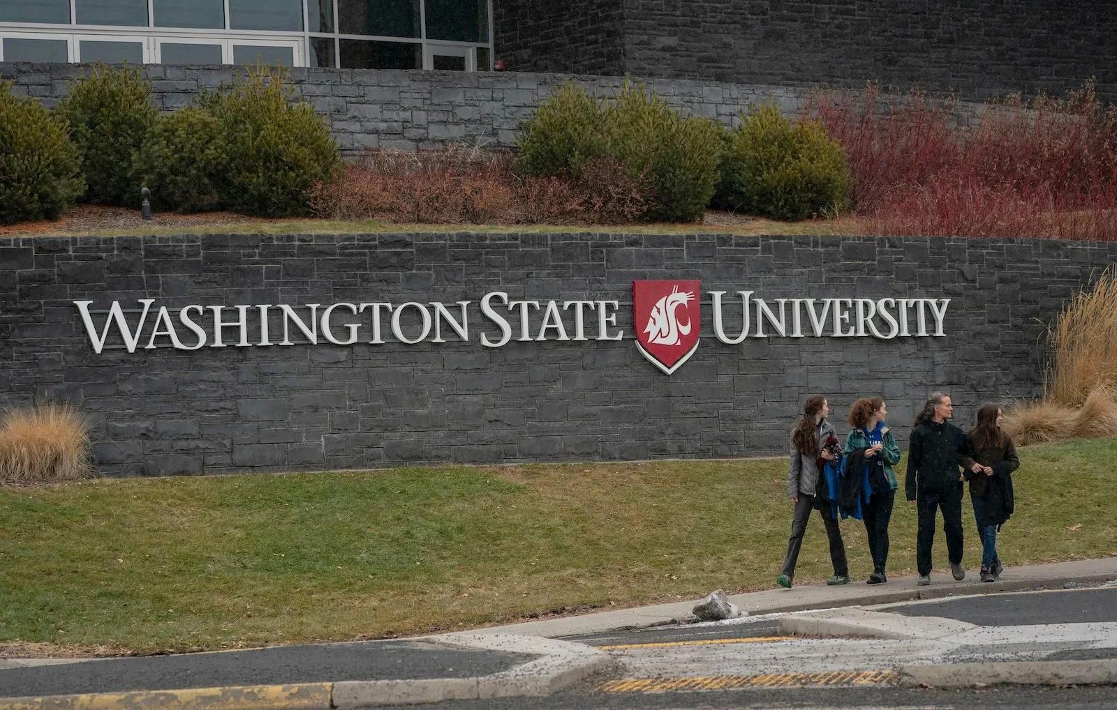 Students exit Washington State University on January 23, 2023.
